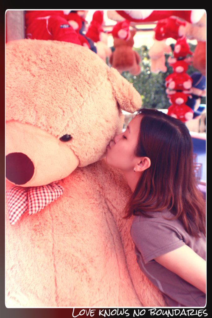 Love knows no boundaries..lol... a giant bear from the game stall
