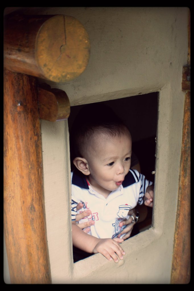 He was running happily around this little hut which fit him only...haha...